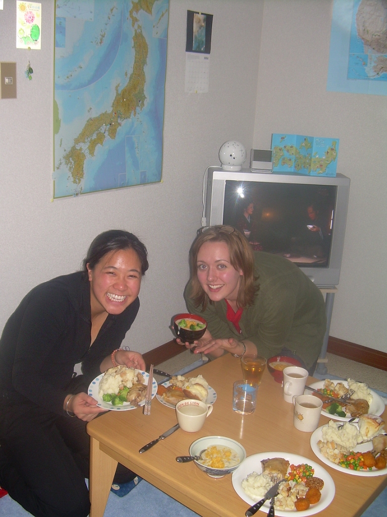 dscn0897.jpg - Myra and Katie at the kotatsu -- that's a low table with a heater beneath it in my living room.