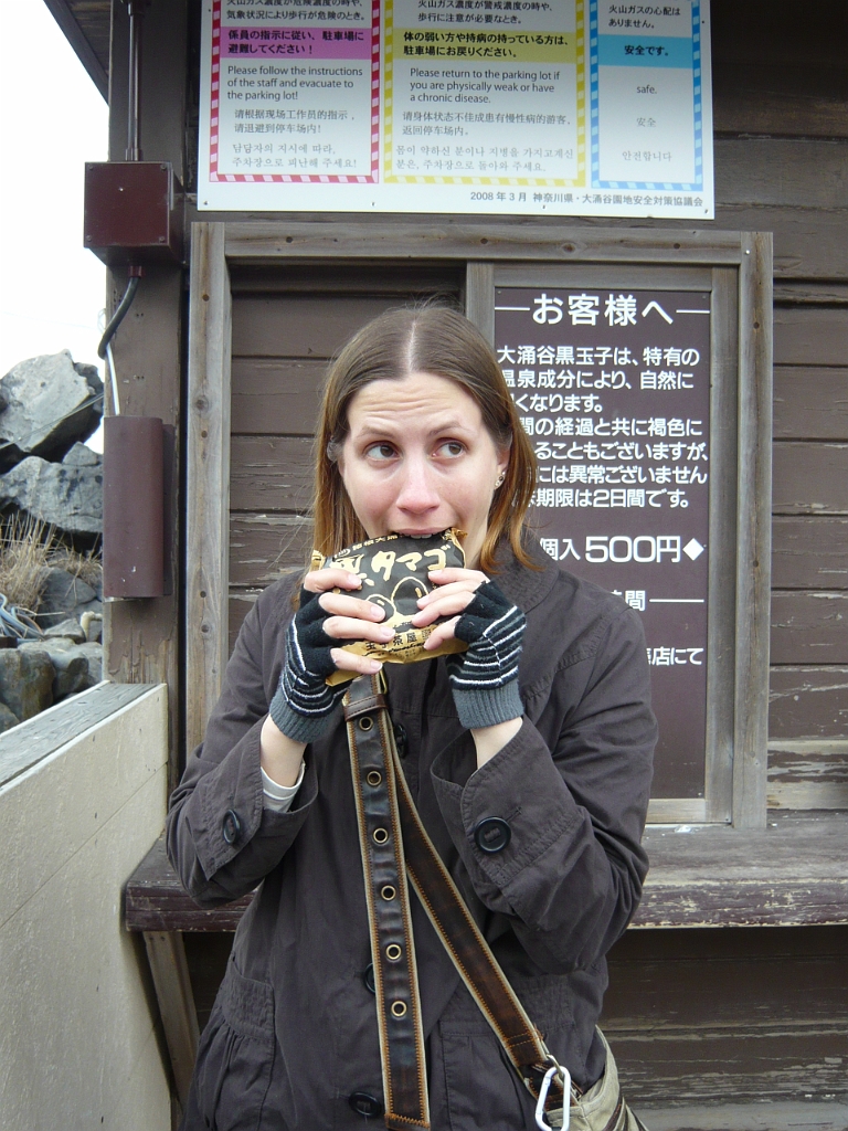 p1000043.jpg - Here is Megan, neglecting to take them out of the packet before eating them.