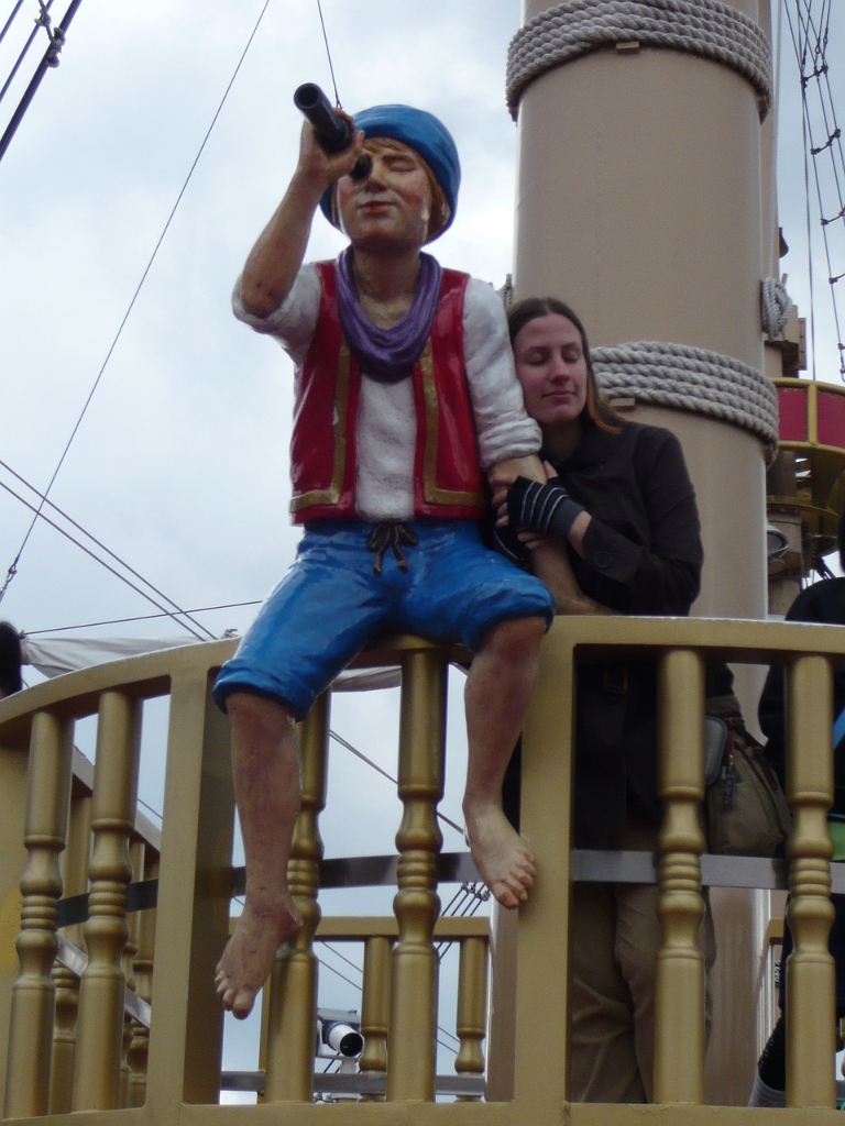 p1000051.jpg - Megan made friends with a plastic sailor boy.