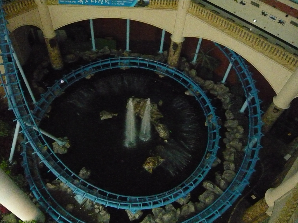 p1010940.jpg - From the balloons, we looked down at this roller coaster, the "French Revolution," which we would (of course) ride later.