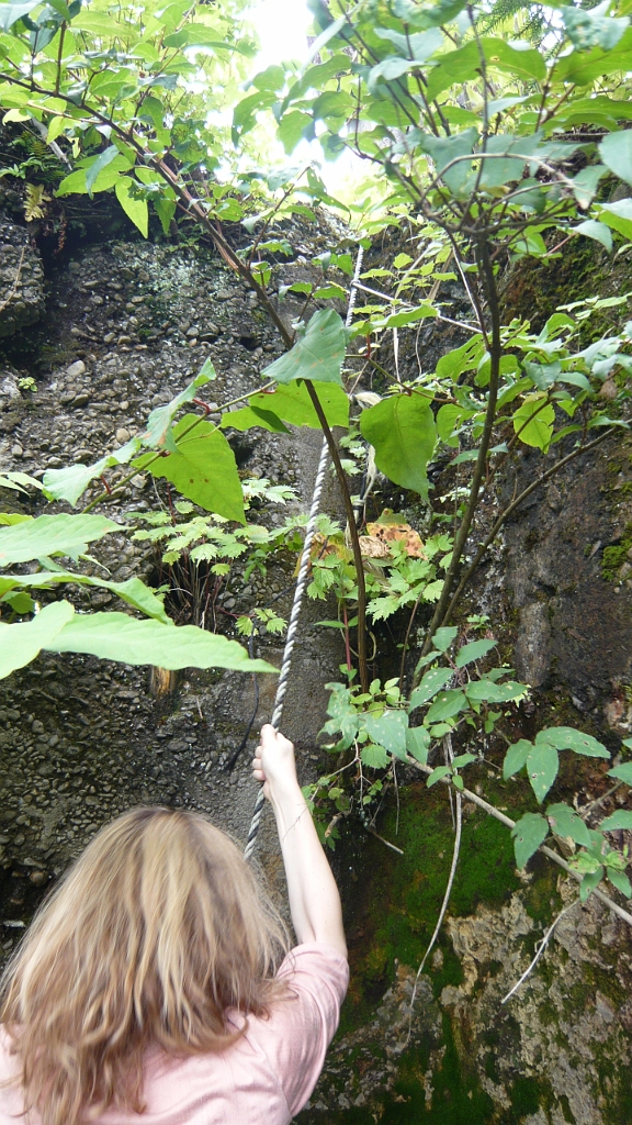 p1020717.jpg - Roxy climbs a rope that we found anchored already for us.