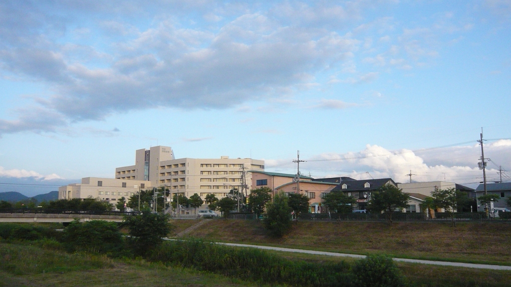 P1020858.JPG - I used to walk along this riverbed.  The building is Nagahama City Hospital, which I actually visited on my first trip to Japan in 1999, to meet my host family's grandmother, who was a patient there.