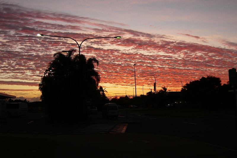 p1010041.jpg - We arrived at Cairns International Terminal at 4:30 a.m.  Our hostel picked us up shortly after 6.  Here is the sunrise as we waited for the shuttle.