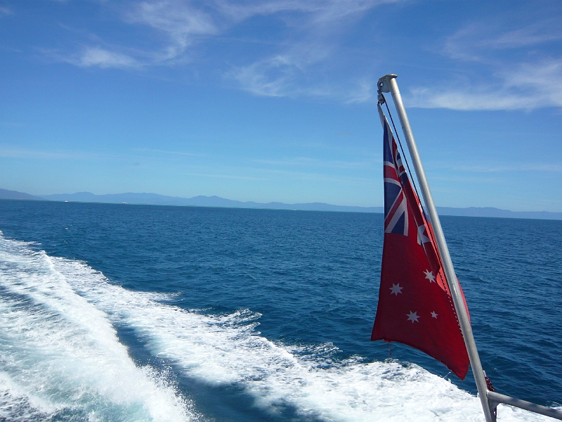 p1010199.jpg - The Australian naval flag flies as we speed off to the Outer Reef.