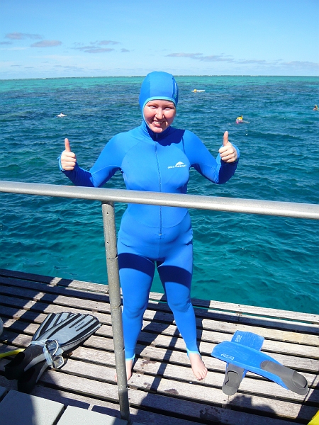 p1010212.jpg - Katie finally decides to brave the jelly-infested waters.  (Actually, I only saw one little square blob of a jellyfish; the jelly season had passed.  But we still wore the suits, as Katie is showing off here.)