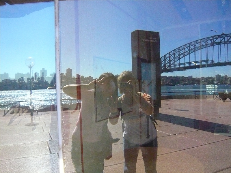 p1010547.jpg - Myra and me reflected in the glass on the side of the Opera House.