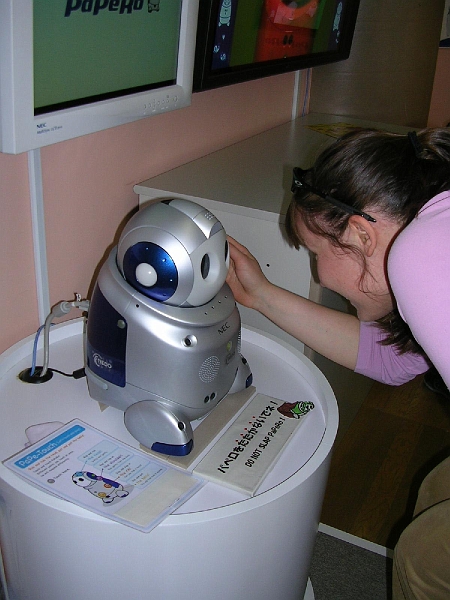 dscn0512.jpg - My friend Rana also came to visit me!  Here she is making friends with a babysitting robot.  (Really.  A babysitting robot.  It blows my mind that the Japanese can build a robot that they're willing to leave with their children but have not come up with a good way to keep their houses warm in the winter.  Psst, Japan: insulation is a marvellous invention.)