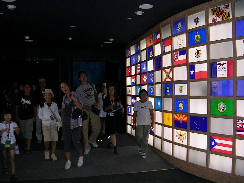 dscn0950.jpg - The very last crowd emerges from the Main Show, past the wall of flags and into the Post-Show.