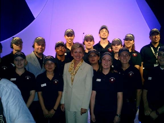 granholm.jpg - Here's the Governor of Michigan, Jennifer Granholm, with all the guides from the Great Lakes State!  (The program was run out of Michigan State University, so there were many of us.)  I'm to her immediate right.  I was Ops that day (that is, coordinator of operations for the guide team).  It was quite a challenge getting all the MI guides free from their positions while still staffing the pavilion enough to keep it running, let me tell you, but somehow we made it work.  That is one of my favorite Expo memories.