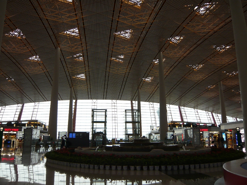 p1020092.jpg - Several of us started our journey in Osaka, and our first layover was in Beijing.  The architecture of the new Beijing Capital Airport makes a clear statement: "Our Olympics were better than yours."